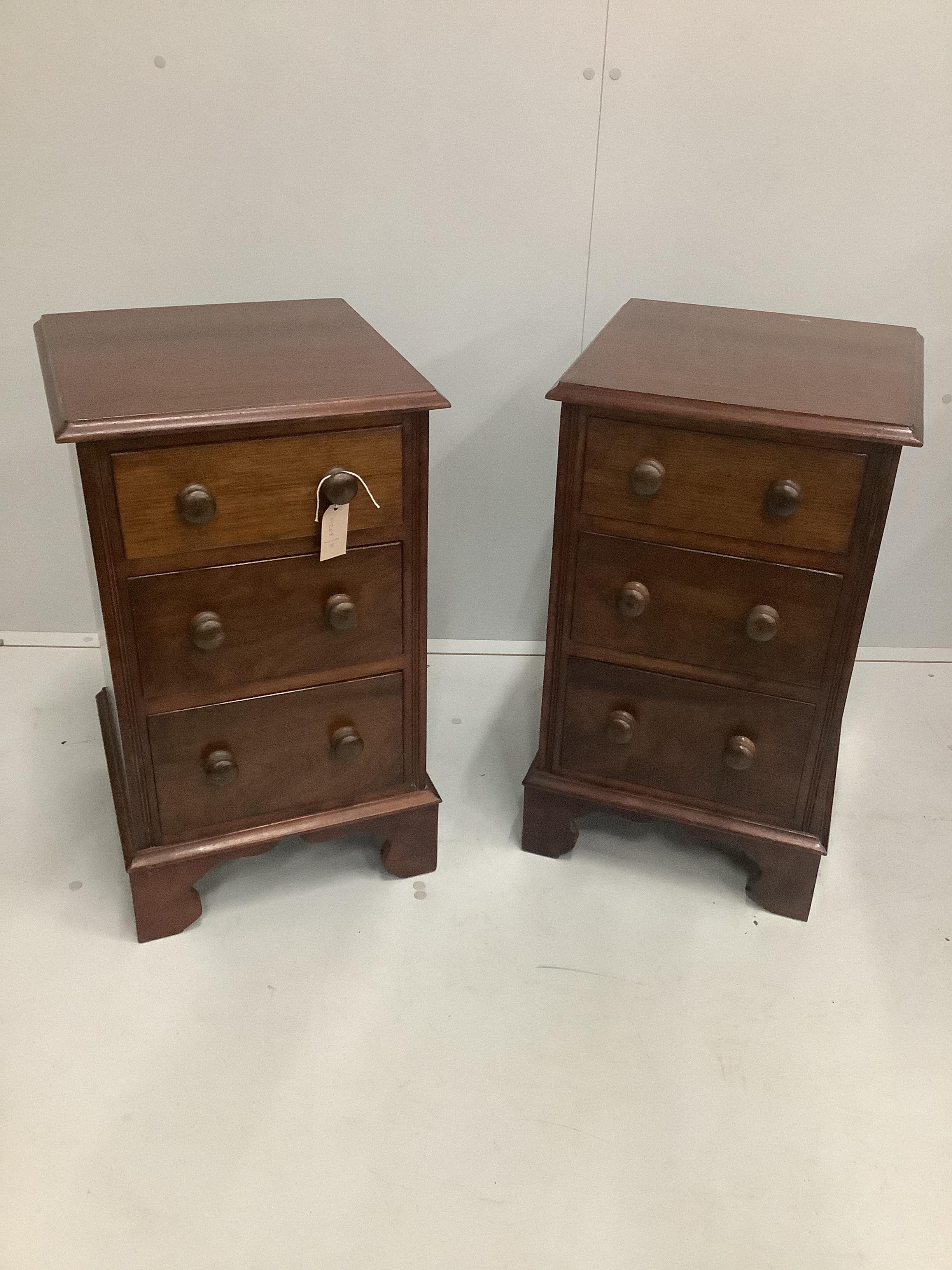 A pair of George III style mahogany three drawer bedside chests, width 39cm, depth 38cm, height 66cm